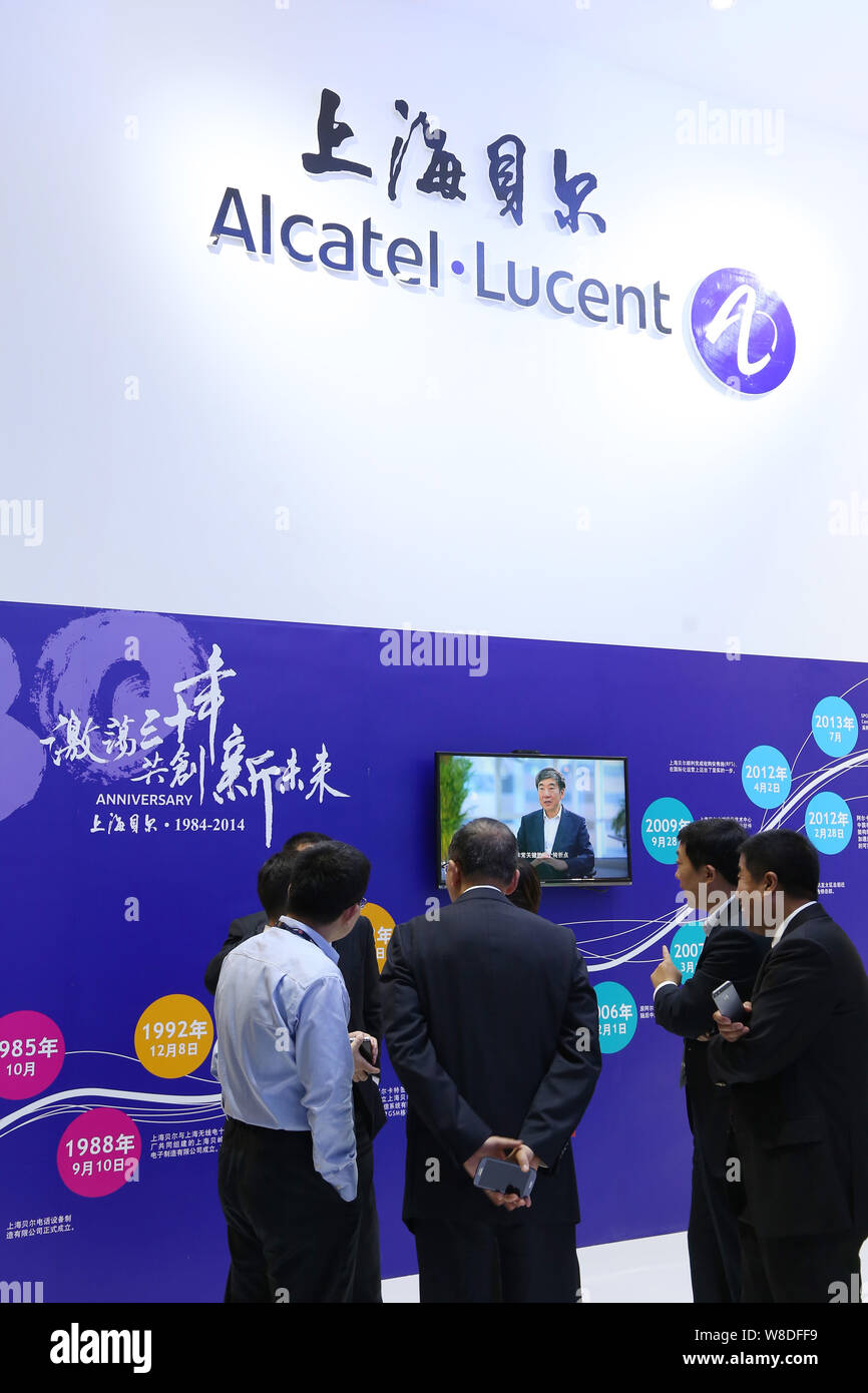 --FILE--People visit the stand of Alcatel-Lucent Shanghai Bell, a joint venture between Alcatel-Lucent and China Huaxin Post & Telecommunication Econo Stock Photo