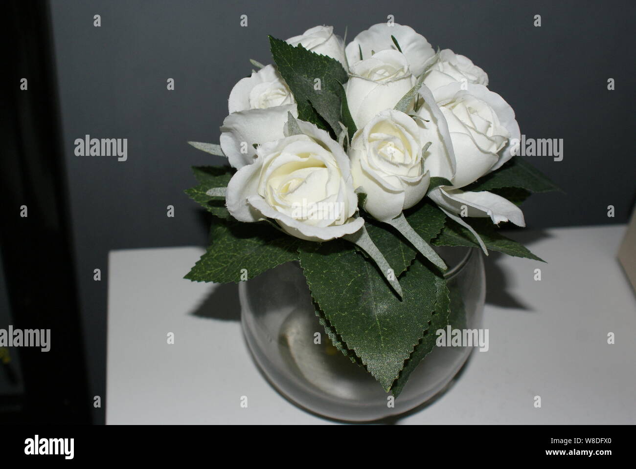 A Small Round Vase Filled With White Roses Stock Photo 263370632