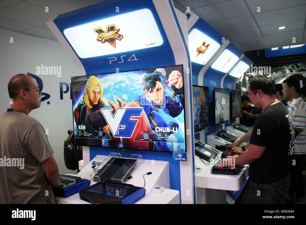 FILE Visitors play electronic games on Sony s PlayStation 4 PS4