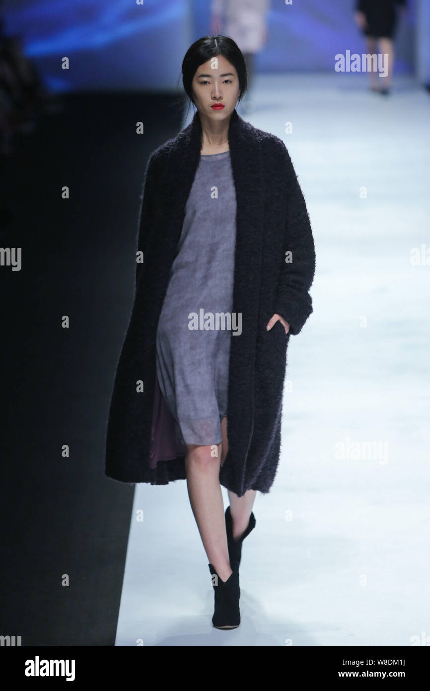 A Model Displays A New Creation At The Tina Gia Fashion Show During The A Model Displays A New Creation At The Tina Gia Fashion Show During The