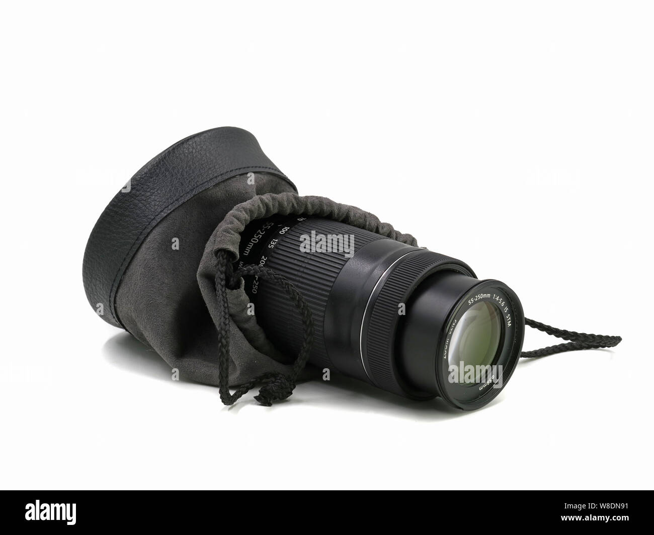 Close up of camera lens with protection bag isolated on white background Stock Photo