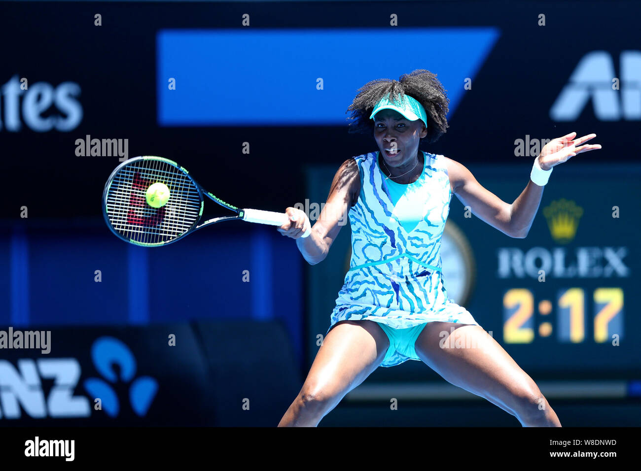 Venus Williams of the U.S. returns a shot to Camila Giorgi of Italy during their third round match at the Australian Open tennis tournament in Melbour Stock Photo