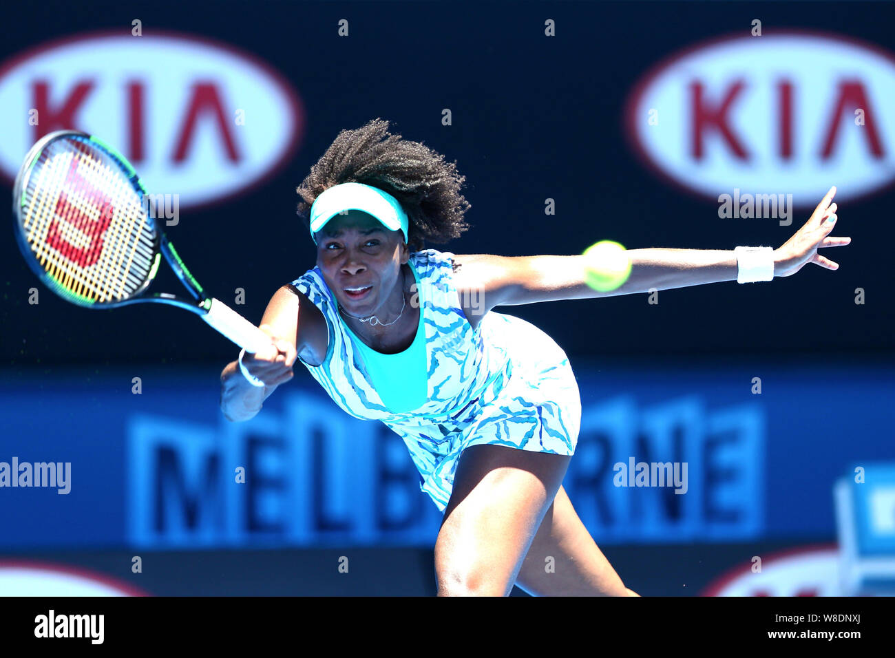 Venus Williams of the U.S. returns a shot to Camila Giorgi of Italy during their third round match at the Australian Open tennis tournament in Melbour Stock Photo