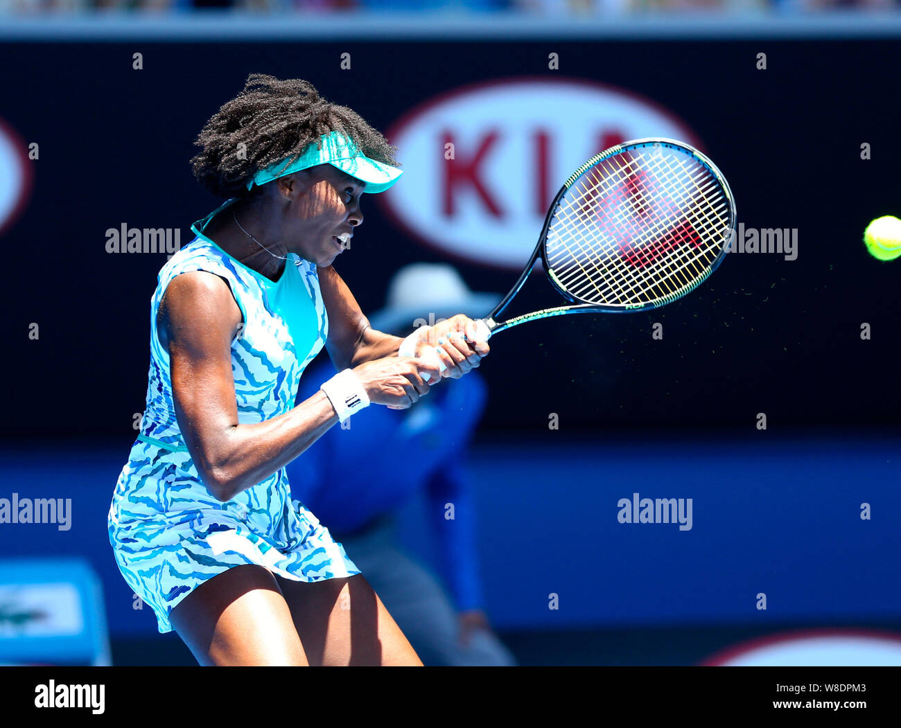 Venus Williams of the U.S. returns a shot to Camila Giorgi of Italy during their third round match at the Australian Open tennis tournament in Melbour Stock Photo