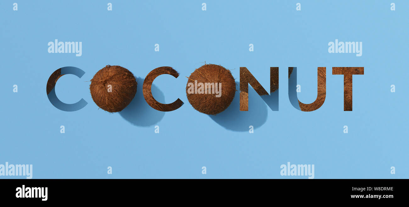 Word coconut with whole coconuts on blue background Stock Photo