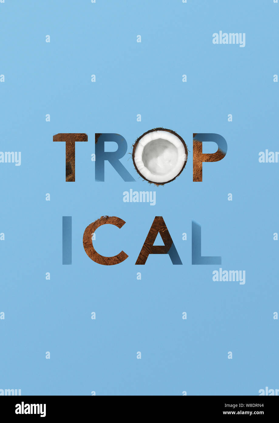 Word tropical with coconuts on blue background Stock Photo