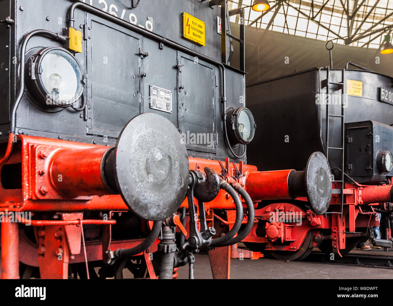 Old steam locomotives in a roundhouse in Germany Stock Photo