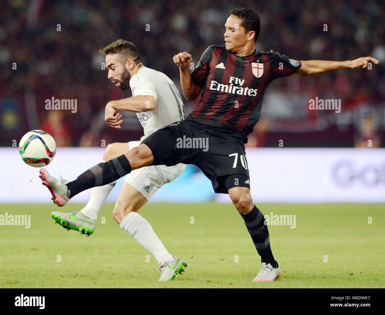 Carlos Arturo Bacca Ahumada of AC Milan, right, challenges Daniel Carvajal of Real Madrid during the Shanghai match of the International Champions Cup Stock Photo