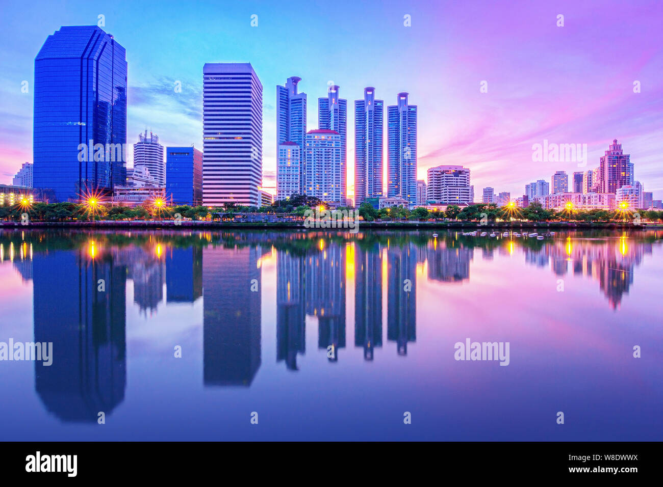 Bangkok city night light reflection on water Stock Photo - Alamy