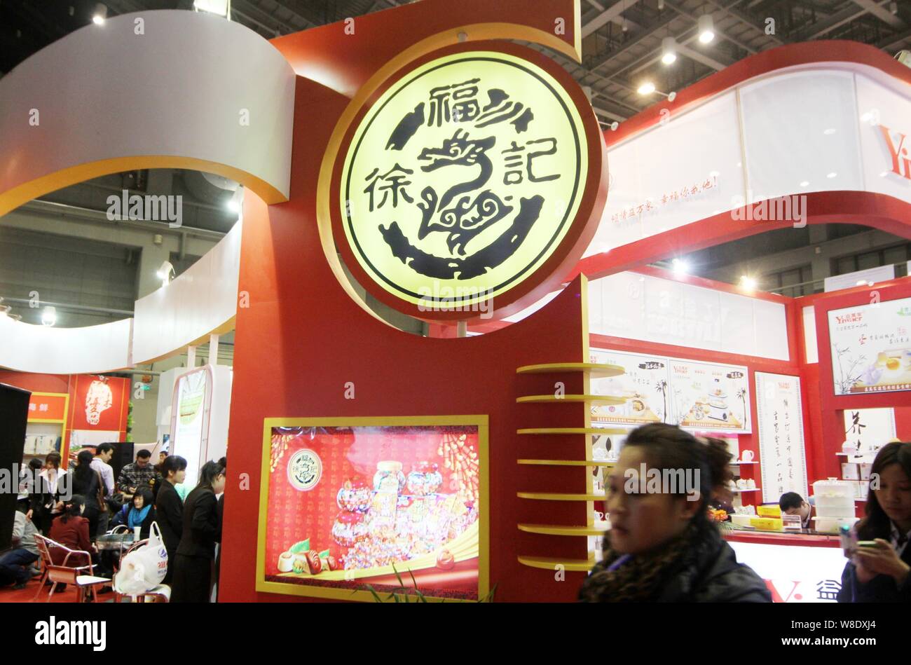 --FILE--People visit the stand of Hsu Fu Chi International Limited during an exhibition in Beijing, China, 25 November 2011.   Nestle SA on Thursday ( Stock Photo