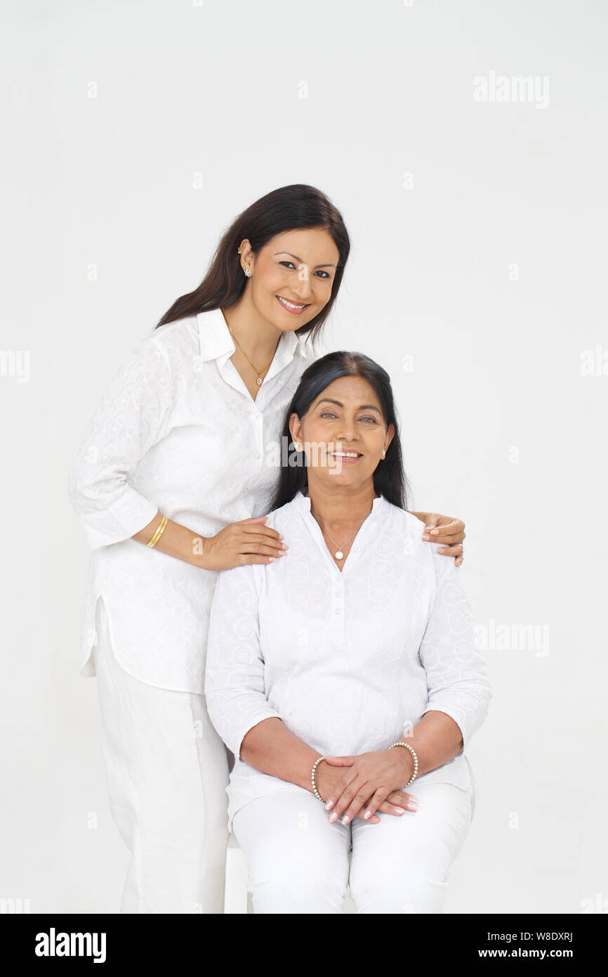 Old woman sitting with her mature daughter Stock Photo image