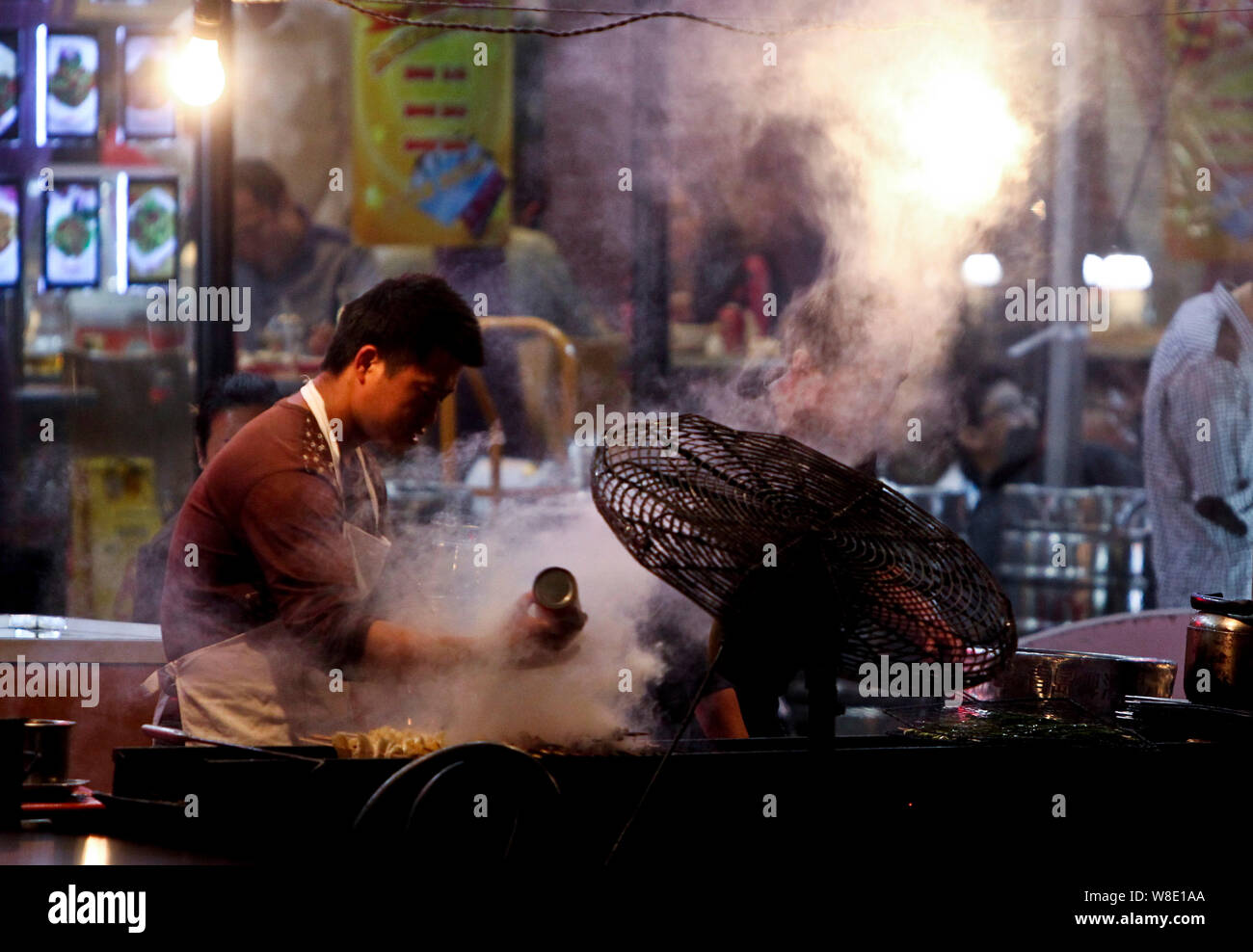 --FILE--Heavy smoke rise from a roadside barbecue stall in Qingdao city, east China's Shandong province, 13 May 2013.   China has scaled up air qualit Stock Photo