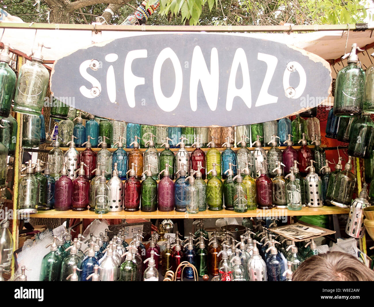Buenos Aires, Argentina- March 4, 2013: colorful siphon water bottles in a row at a market stall in San Telmo Market in Buenos Aires Stock Photo