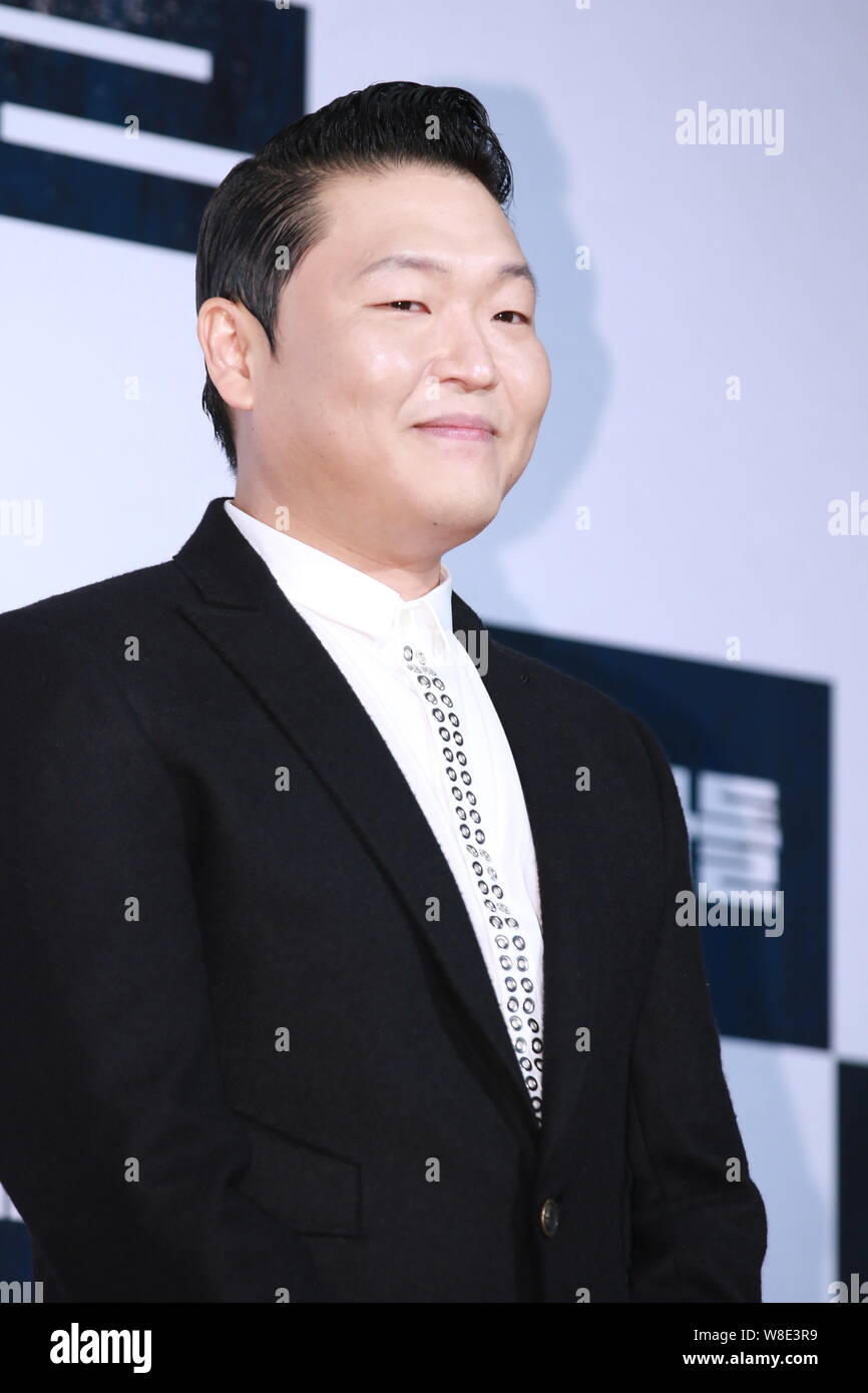 South Korean singer Park Jae-sang, better known by his stage name PSY, poses as he arrives for a VIP screening event of the new movie 'Inside Men' in Stock Photo