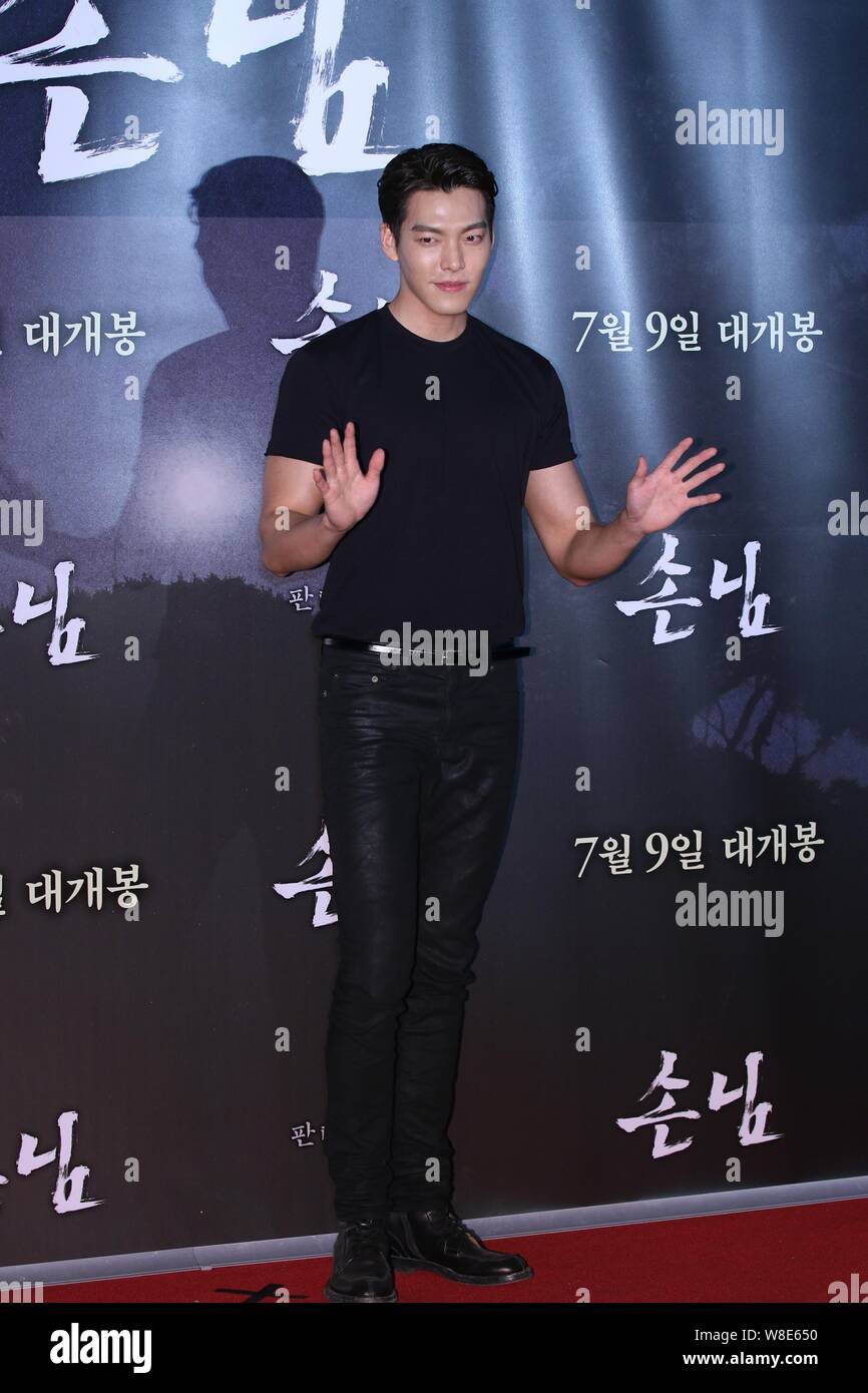 South Korean actor Kim Woo-bin poses as he arrives for an VIP screening event of the new movie 'The Guest', also released as 'The Piper', in Seoul, So Stock Photo