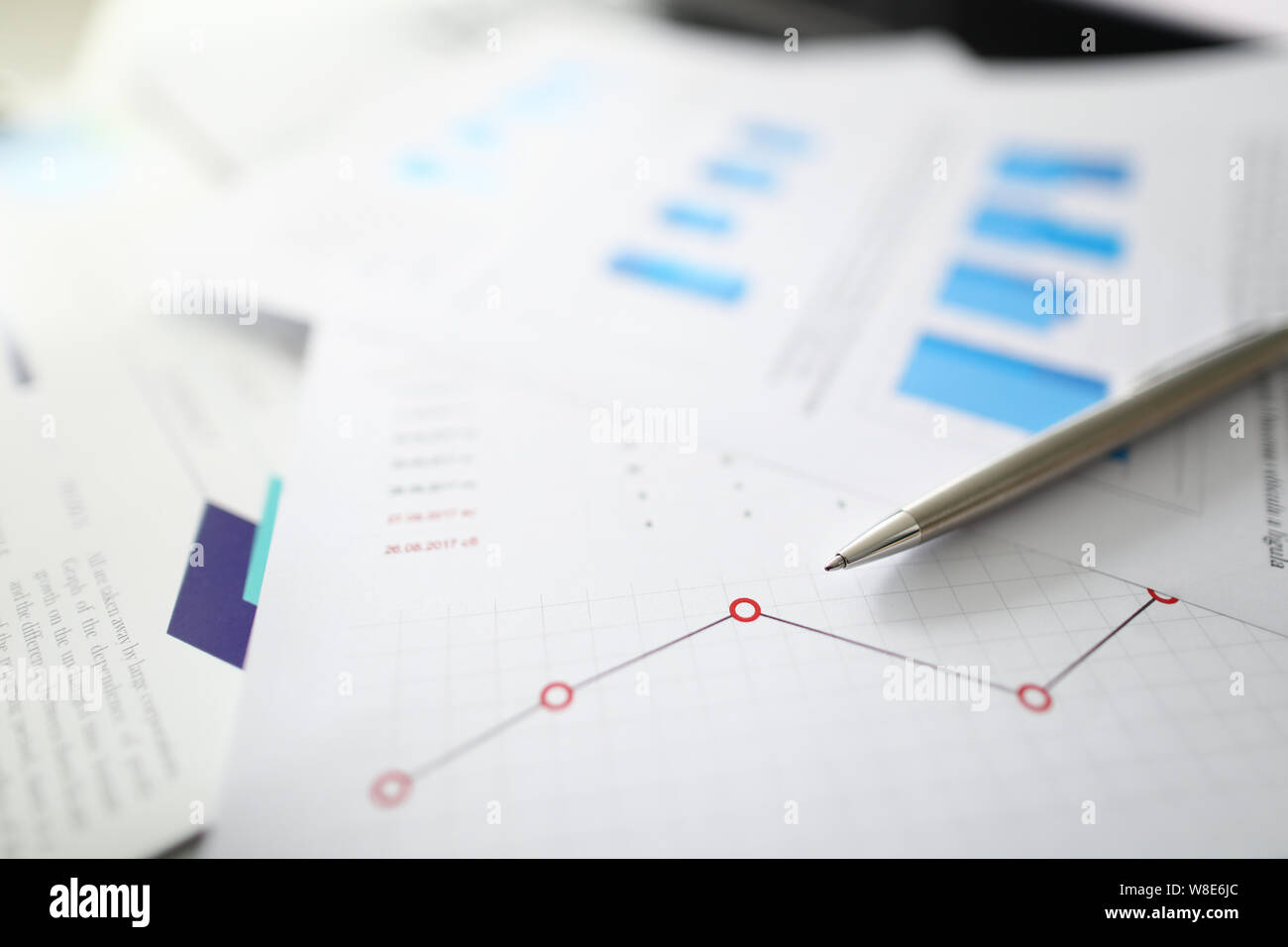 Silver pen lies on documents with Stock Photo