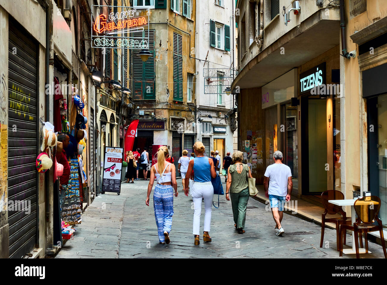 Genoa (Genova), Italy - July 06, 2019:  Old street in Genoa with walking people Stock Photo