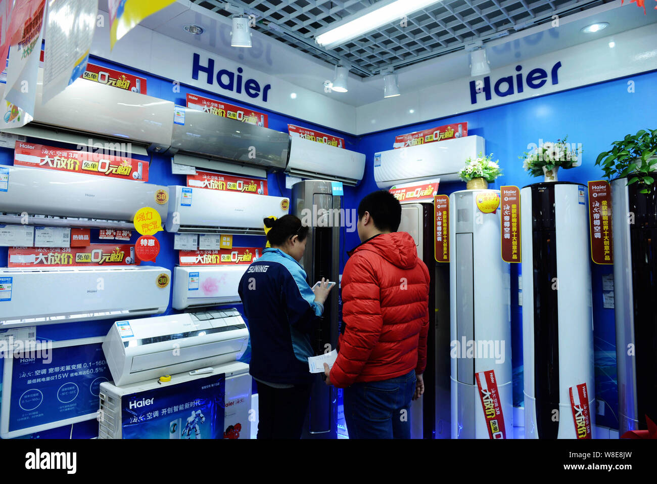 FILE A customer shops for a Haier air conditioner in a Suning