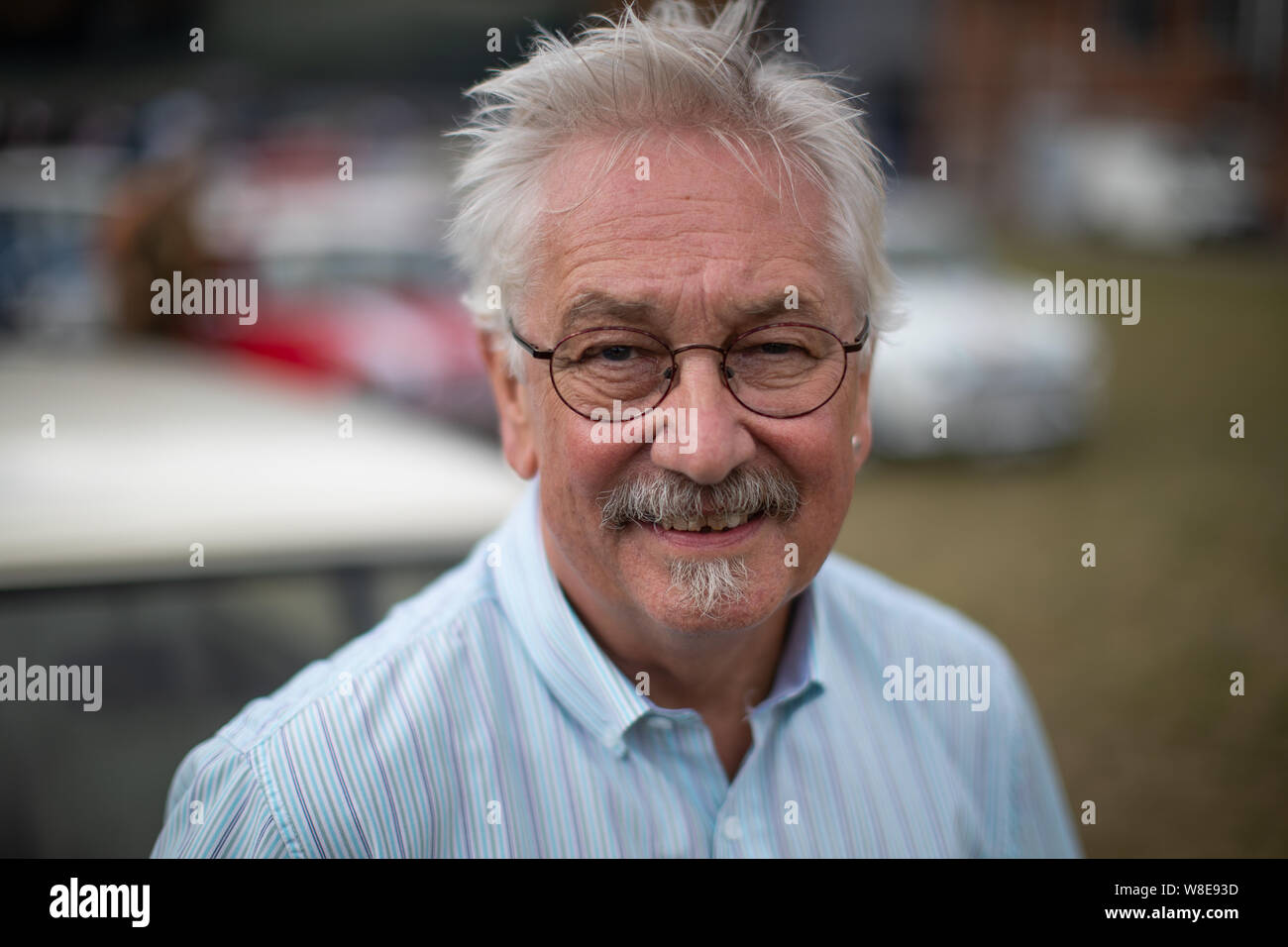Mike Fisher, 70, the oldest and longest serving employee of the Mini Plant Oxford celebrates the 60th anniversary of the Mini Cooper. Stock Photo