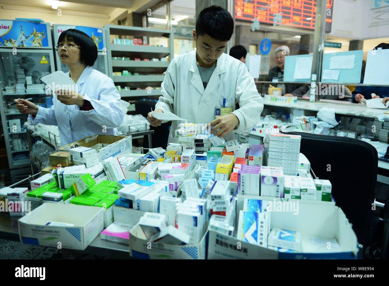 FILEChinese medical workers dispense medicines according to a