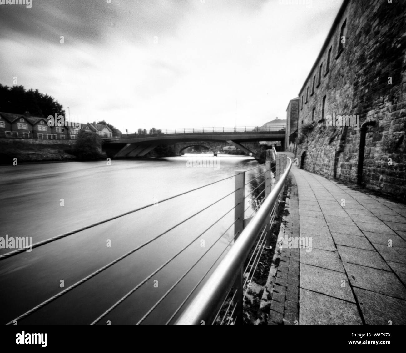 River Erne and West Bridge, Enniskillen, Co. Fermanagh, Northern Ireland. This black and white camera obscura photo is NOT sharp due to camera charact Stock Photo