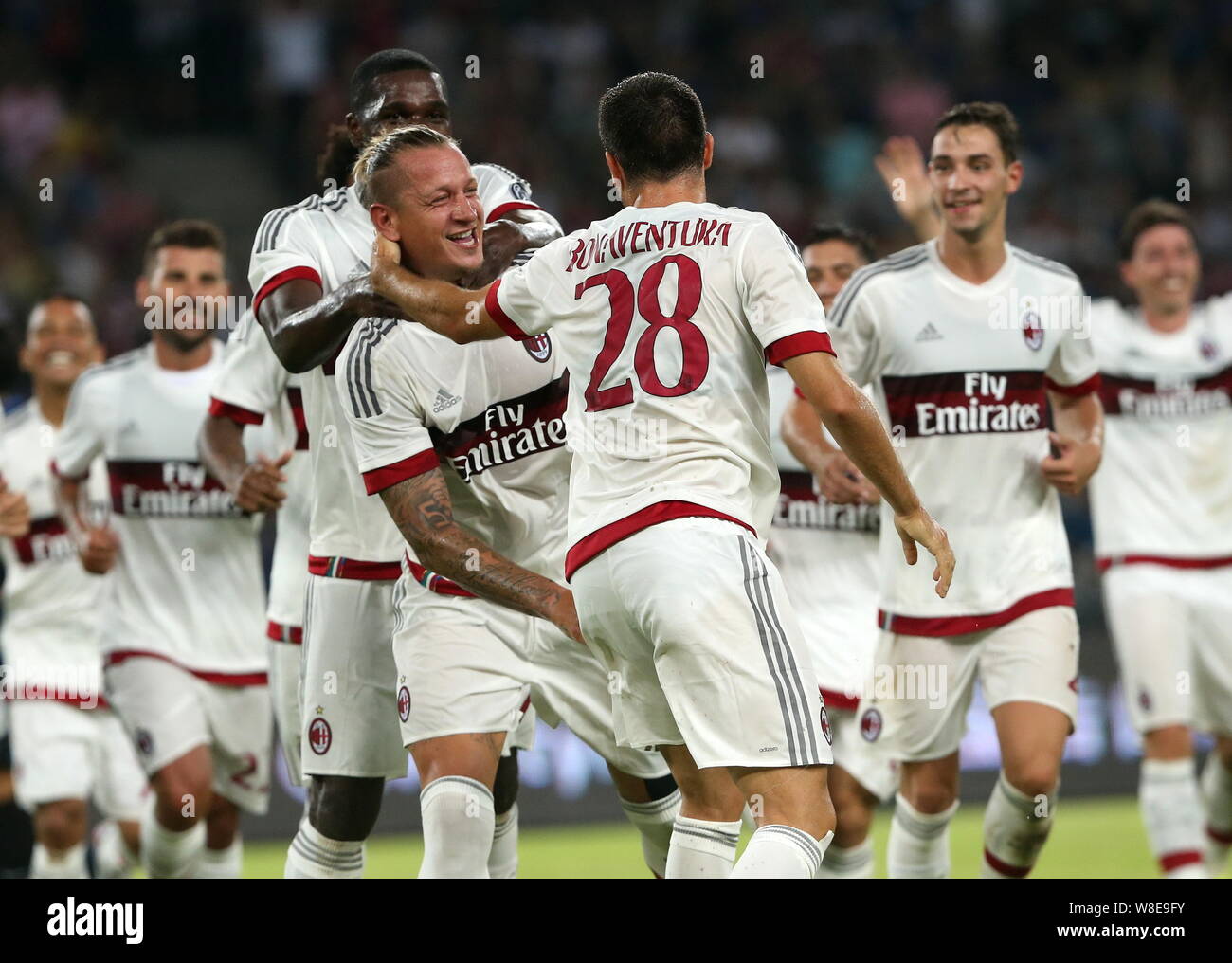 Philippe Mexes of AC Milan, left, celebrates with team members after  scoring a goal against Inter Milan in a soccer match during the 2015  Internationa Stock Photo - Alamy, image size:1300x1016