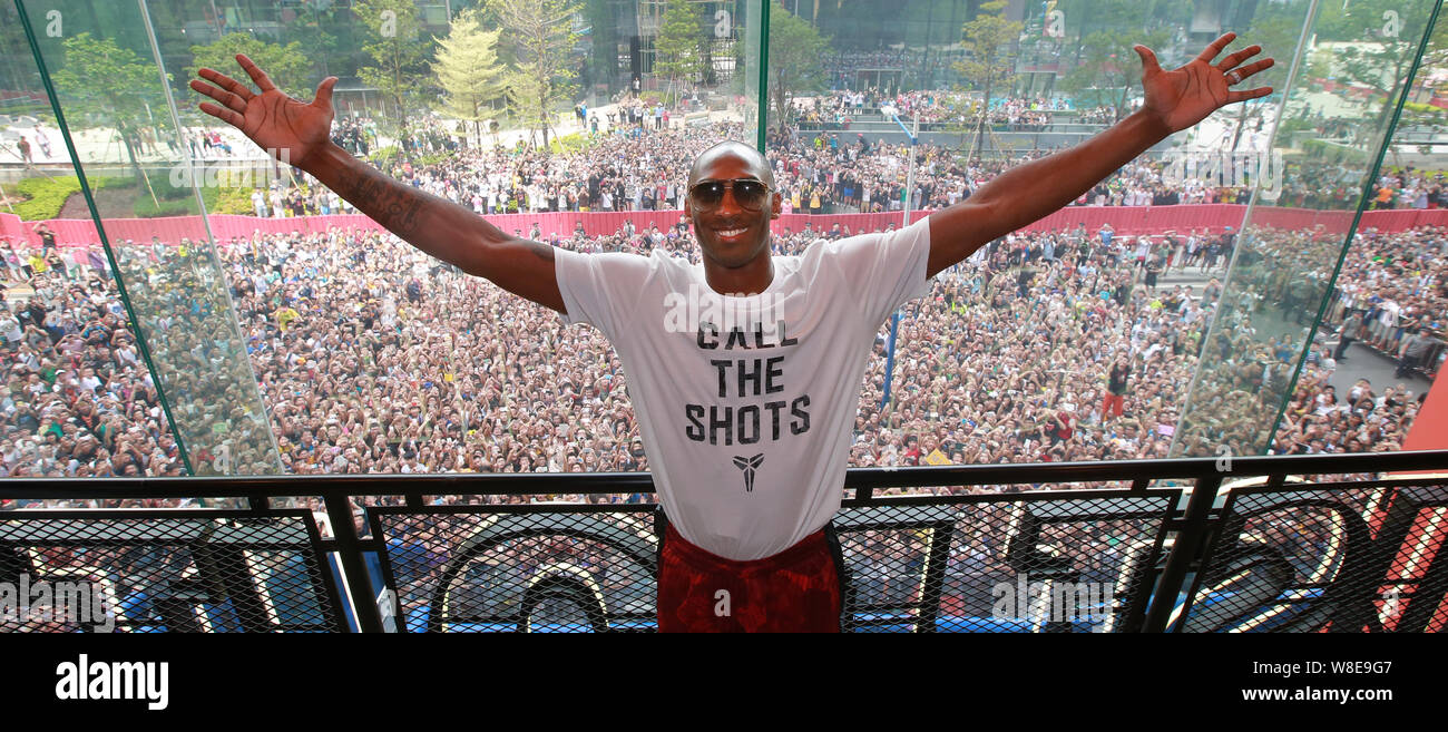 NBA superstar Kobe Bryant poses inside a sportswear store in front of a crowd of Chinese basketball fans at a promotional event of Nike in Guangzhou c Stock Photo Alamy