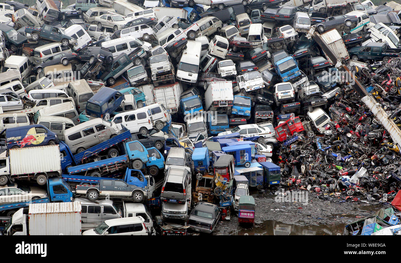 Aerial view of a junkyard piled high with scrapped vehicles in Hangzhou