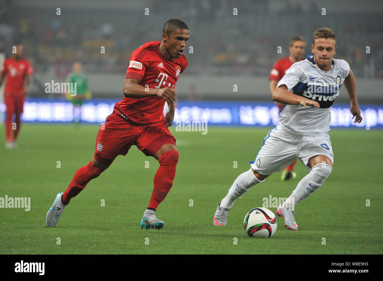 Federico Dimarco of Inter Milan, right, challenges Douglas Costa of Bayern  Munich, left, during a friendly match between Bayern Munich and Inter Milan  Stock Photo - Alamy