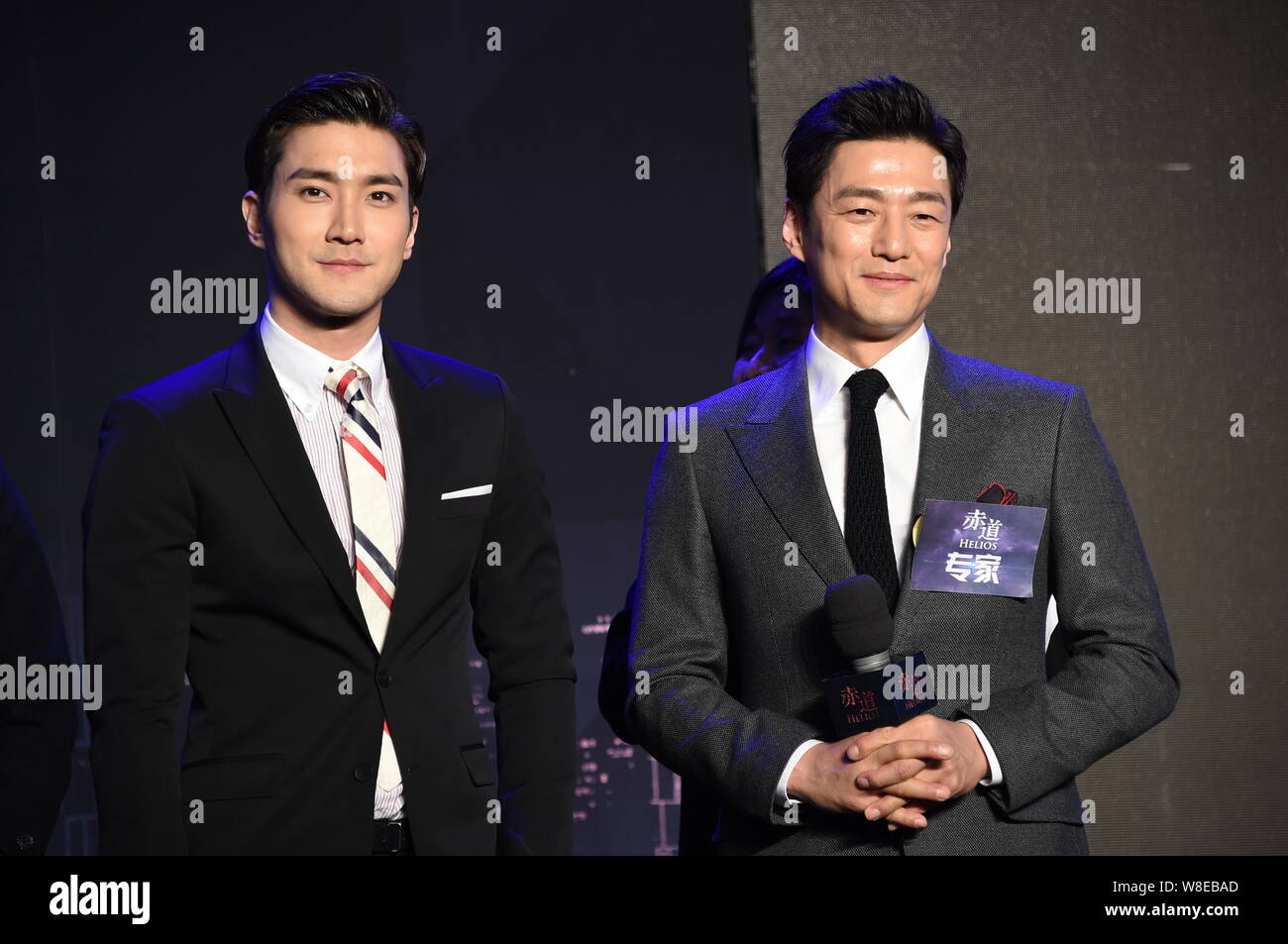South Korean actors Choi Siwon, left, and Ji Jin-hee attend a press conference for their new movie 'Helios' in Beijing, China, 9 March 2015. Stock Photo