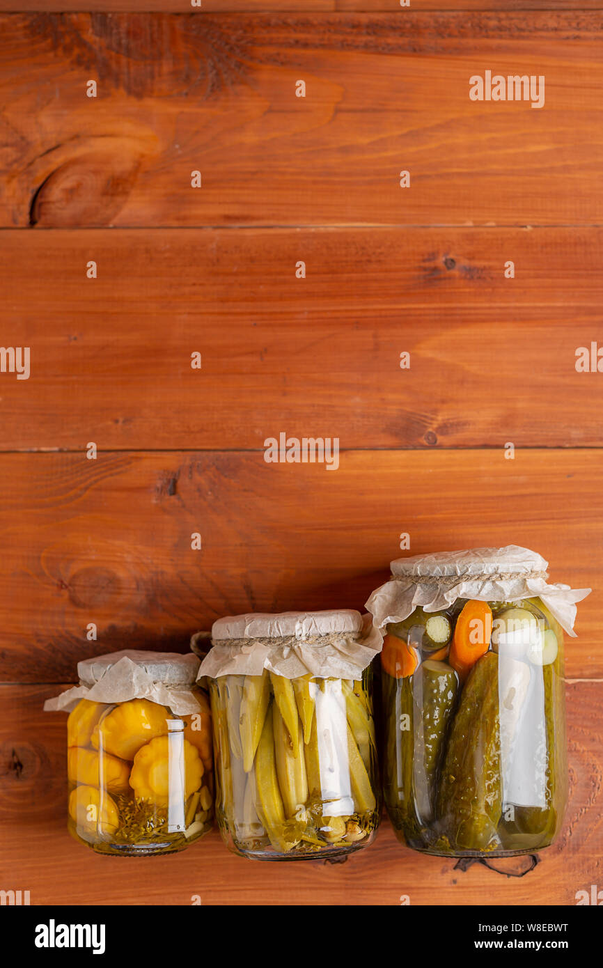 Salting various vegetables in glass jars for longterm storage. Preserves vegetables in glass