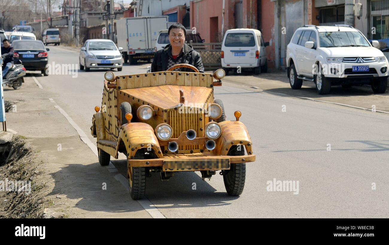 Chinese carpenter Liu Fulong testdrives his third homemade wooden