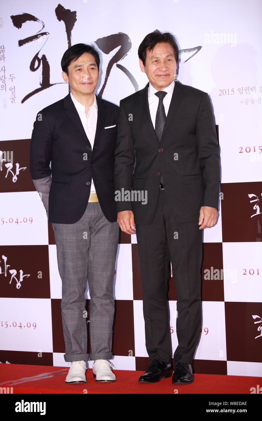 Hong Kong actor Tony Leung, left, and South Korean actor Ahn Sung-ki pose at a VIP preview for Ahn's new movie 'Revivre' in Seoul, South Korea, 6 Apri Stock Photo