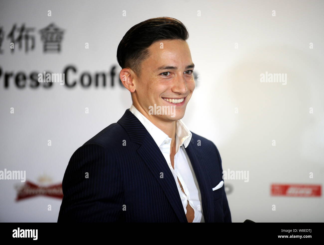 German gymnast Marcel Nguyen smiles during a press conference for the 2015 Porsche Carrera Cup Asia season in Hong Kong, China, 1 April 2015. Stock Photo