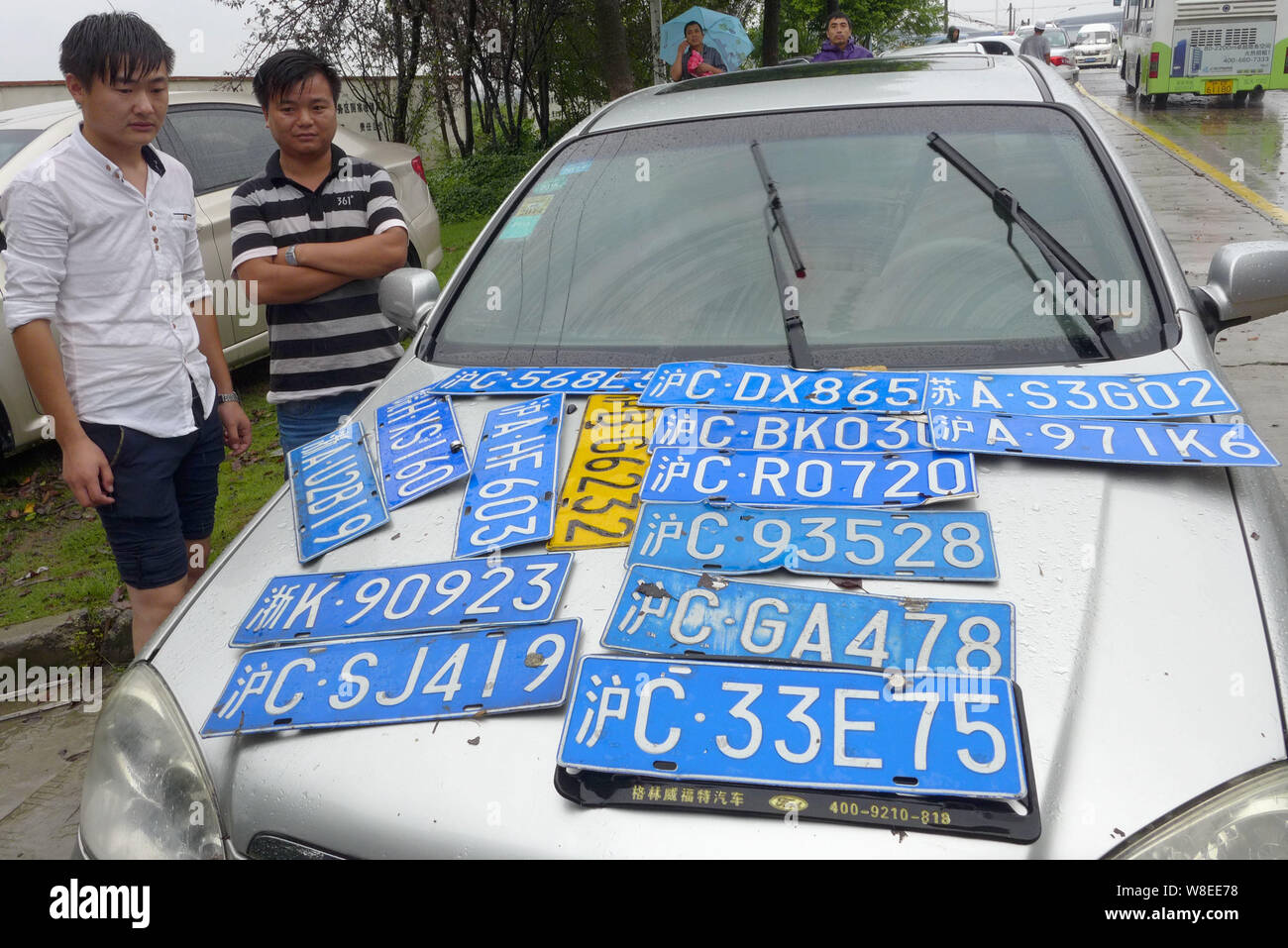 Unclaimed car plates which were washed away by heavy rains caused by ...