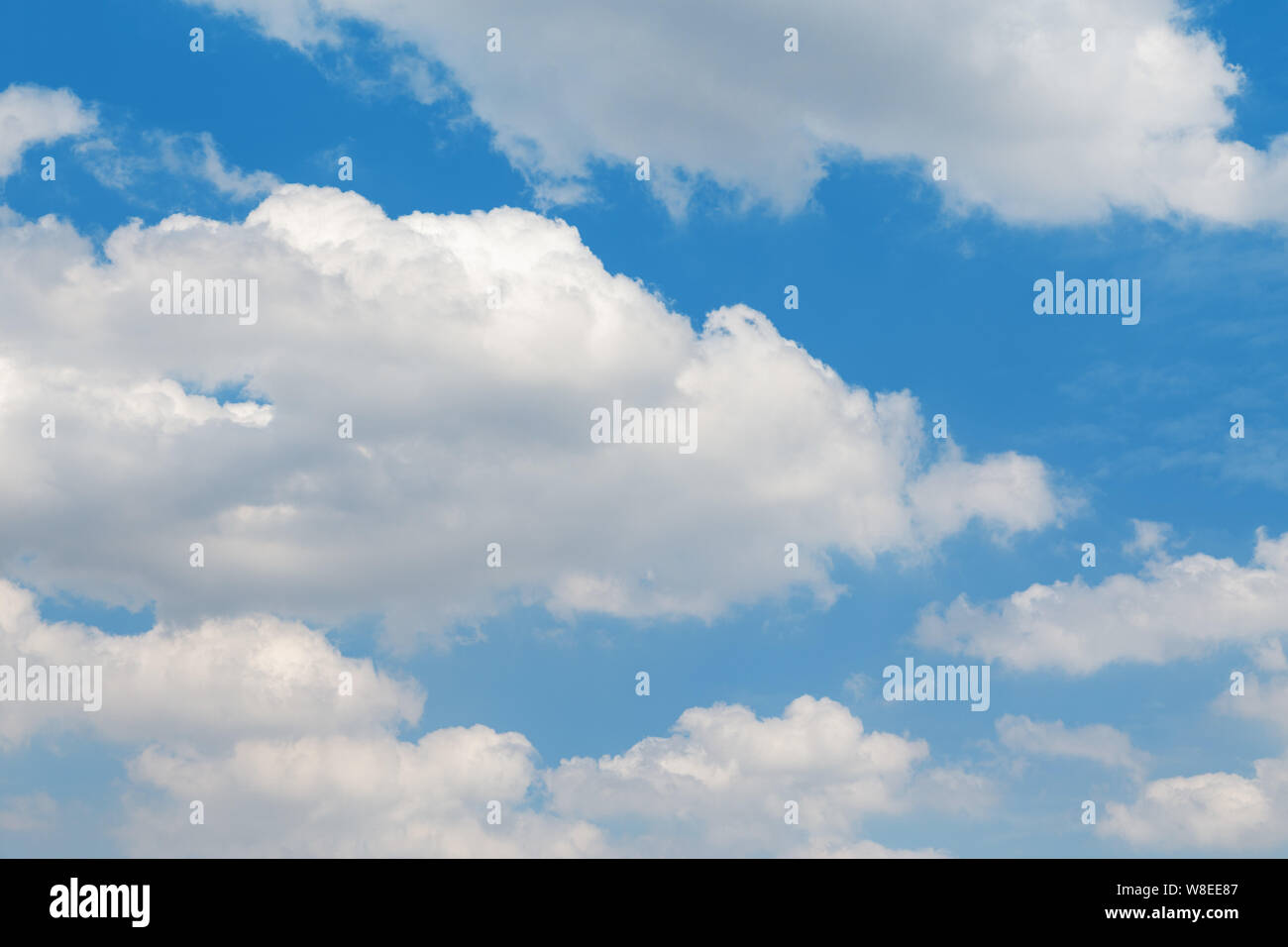 White clouds in the blue sky. Natural background Stock Photo - Alamy