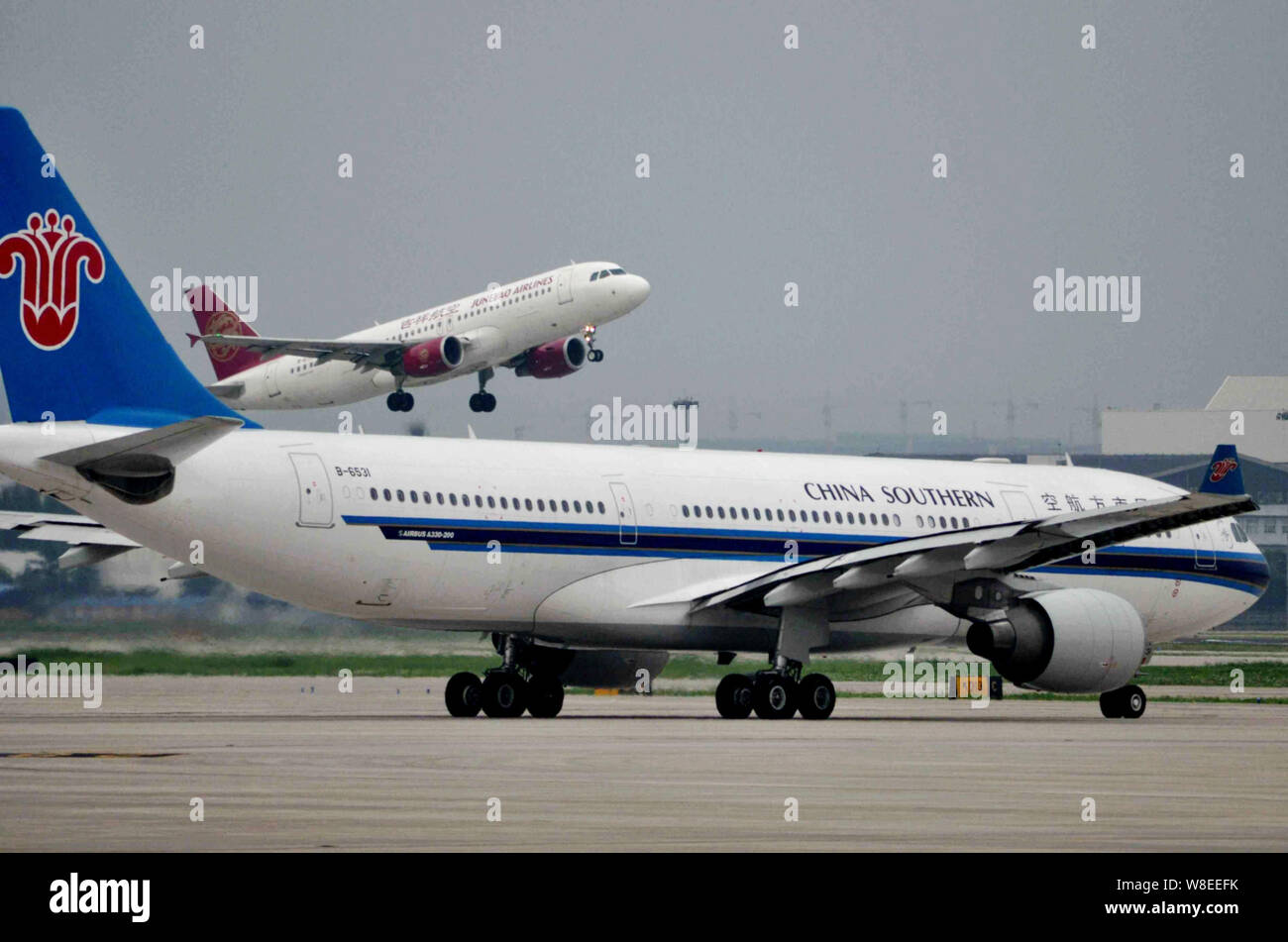 FILE--An Airbus A330-200 jet plane of China Southern Airlines, front, taxis  at the Shanghai Hongqiao International Airport in Shanghai, China, 7 Jul  Stock Photo - Alamy