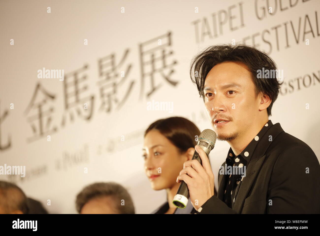 Taiwanese actor Chang Chen, right, speaks at an event for candidates of ...
