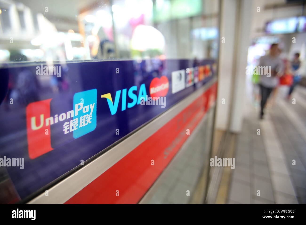 --FILE--A signboard of China UnionPay, Visa and MasterCard is pictured ...