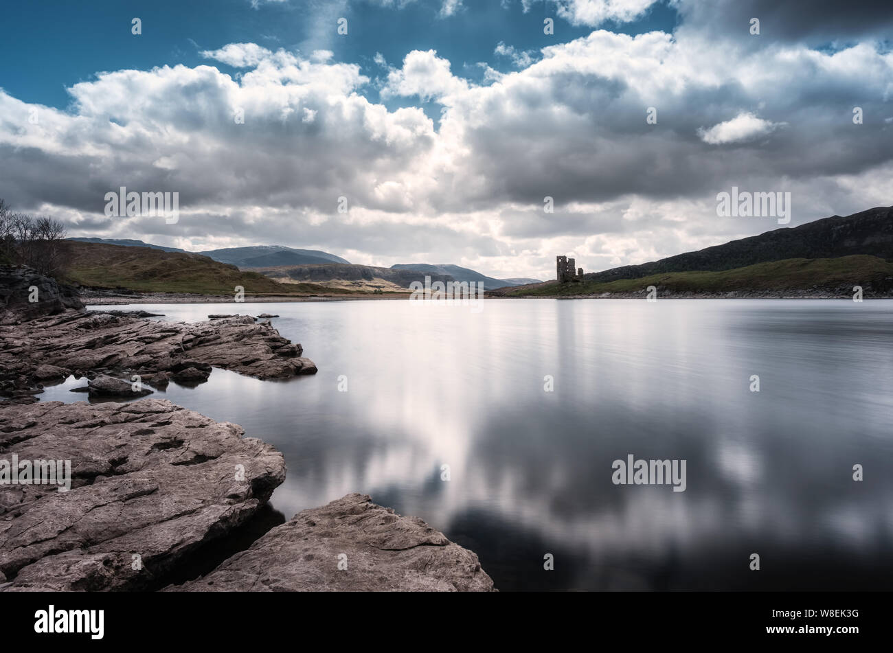 Ruins of 15th century Ardvreck Castle standing on a Promontory on the banks of Loch Assynt in the Highloands of Scotland Stock Photo