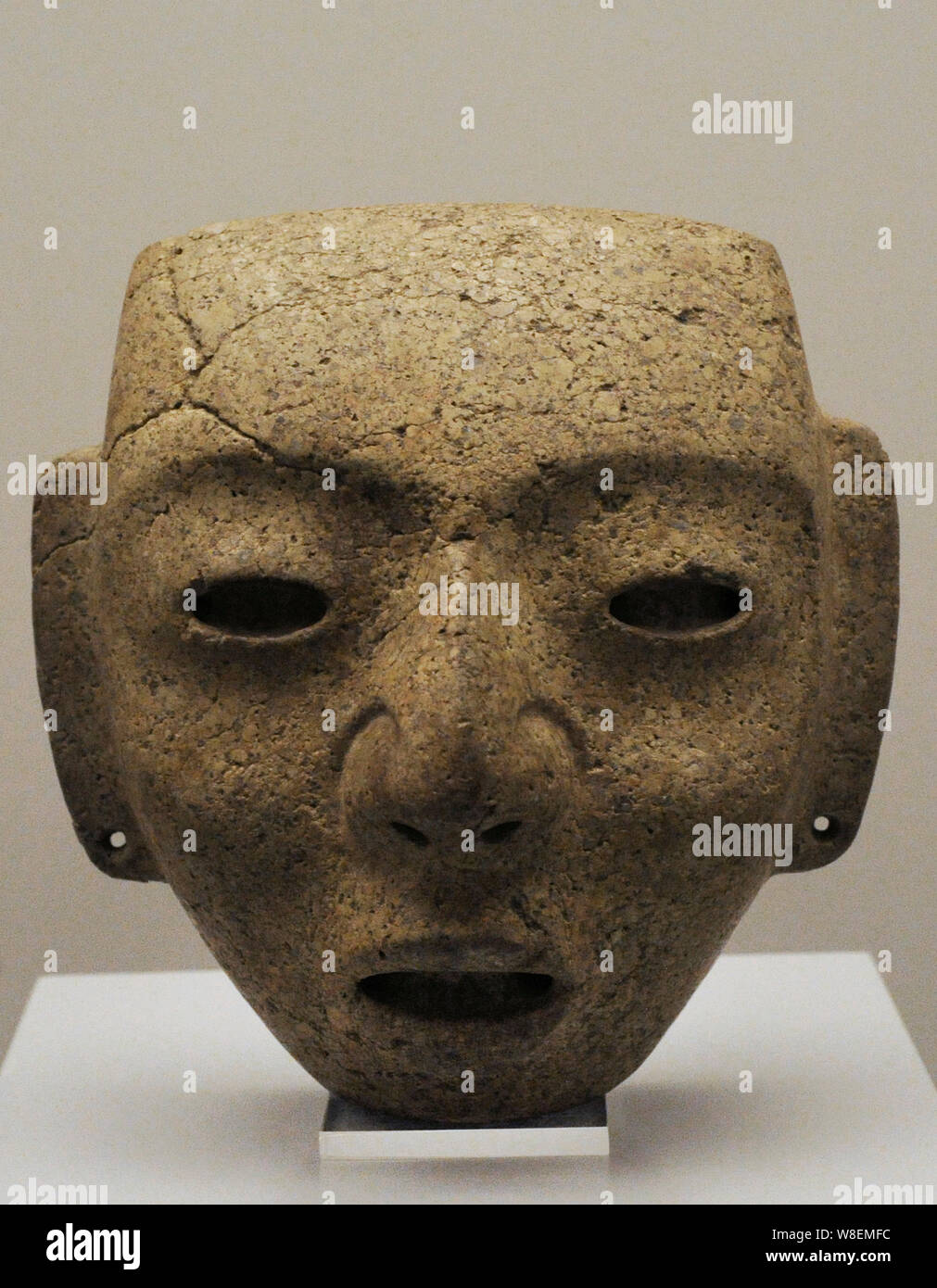 Mask depicting a human face. Stone. Teotihuacan III-IV. Xolalpan Phase. Middle Classic Period (400-700 AD). Central Mexico. Museum of the Americas. Madrid, Spain. Stock Photo