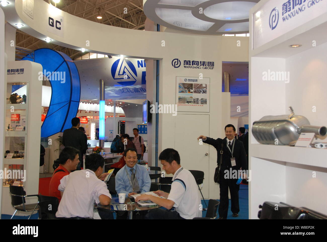 --FILE--People visit the stand of Wanxiang Group during an exhibition in Beijing, China, 25 September 2010.   Chinese auto parts maker Wanxiang Group Stock Photo