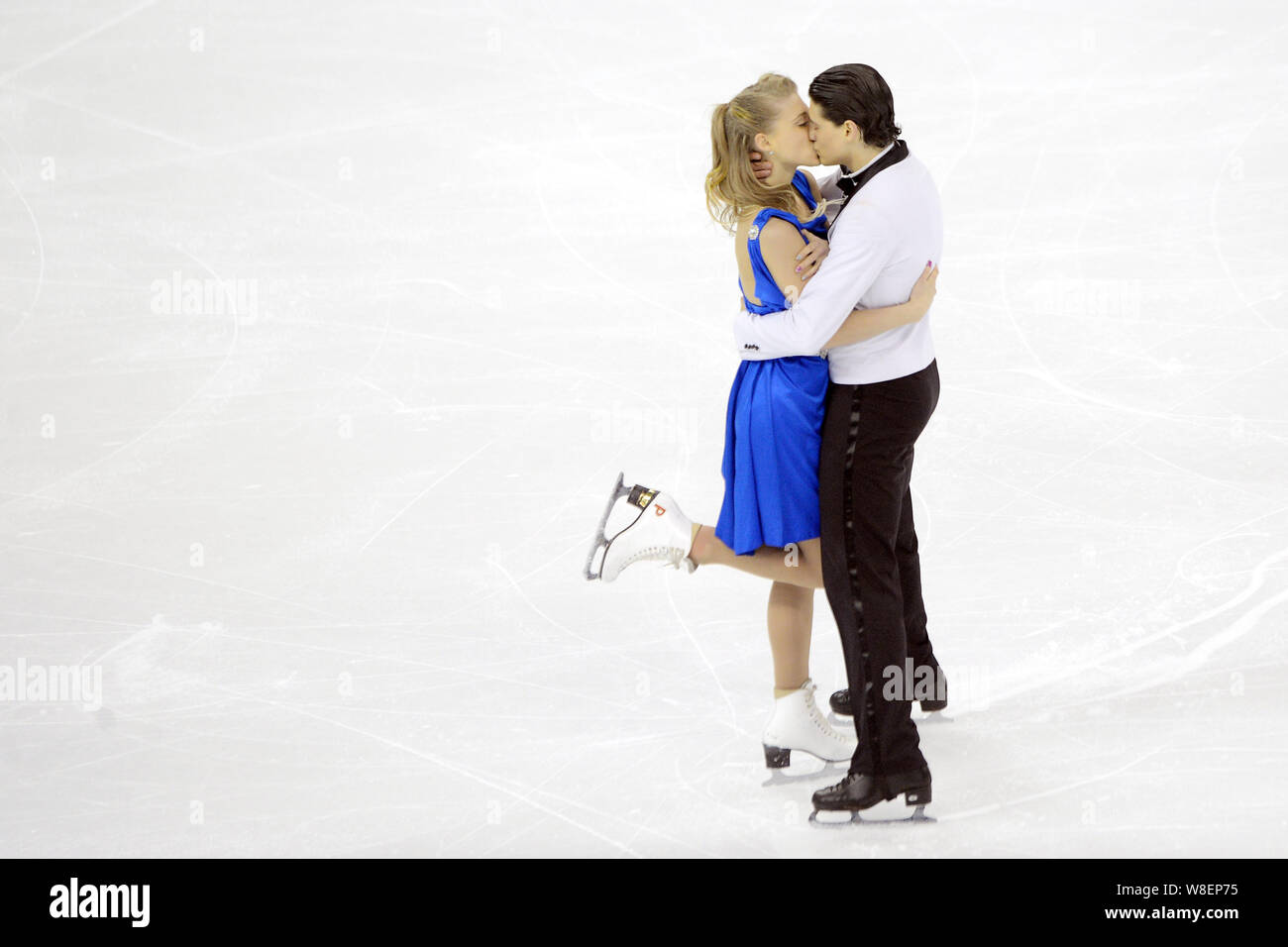 Piper Gilles and Paul Poirier of Canada kiss as they perform during the