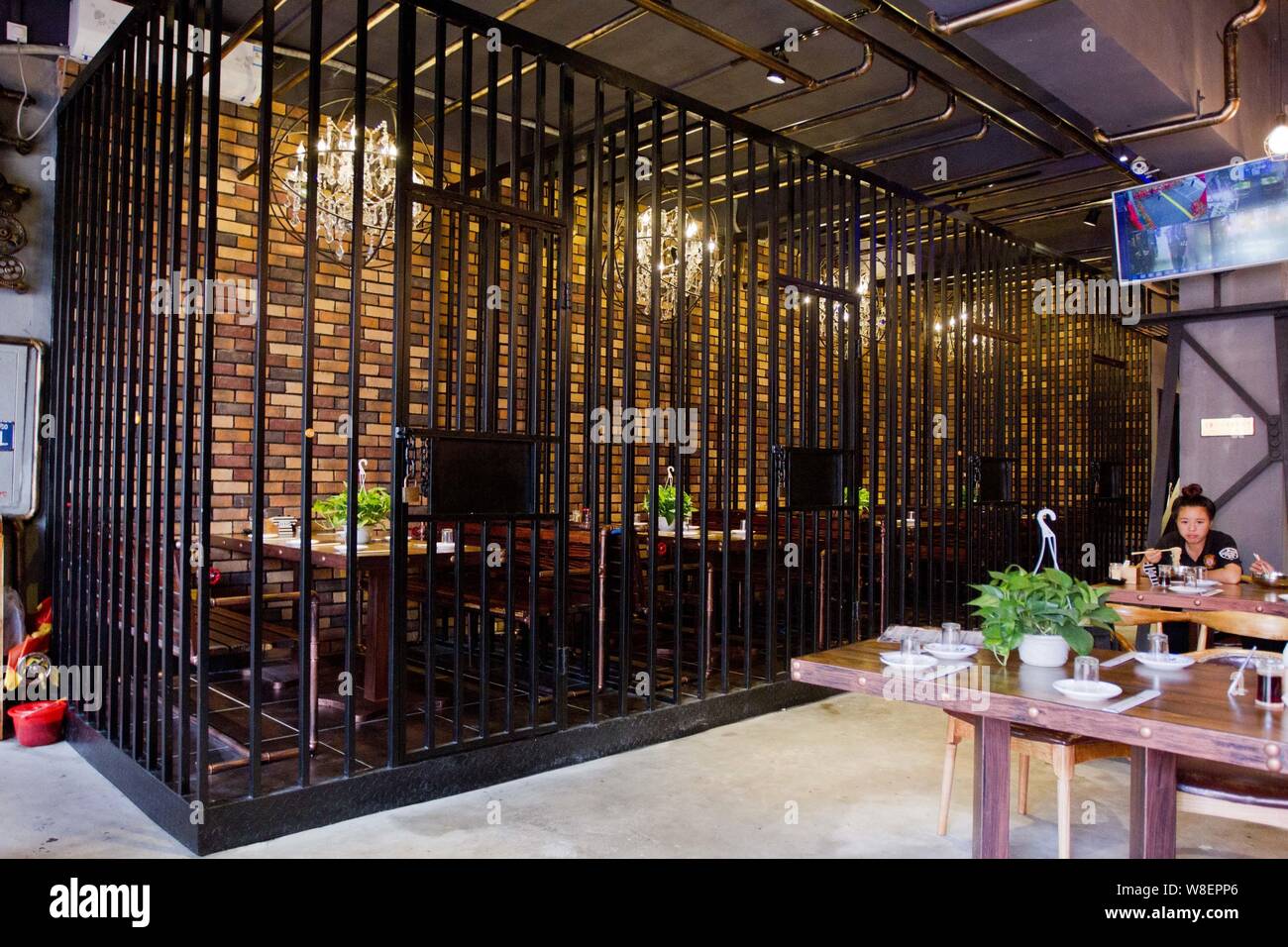 View of dining rooms at a prison-themed restaurant in Jilin city, northeast China's Jilin province, 25 August 2015.   A new prison-themed restaurant o Stock Photo