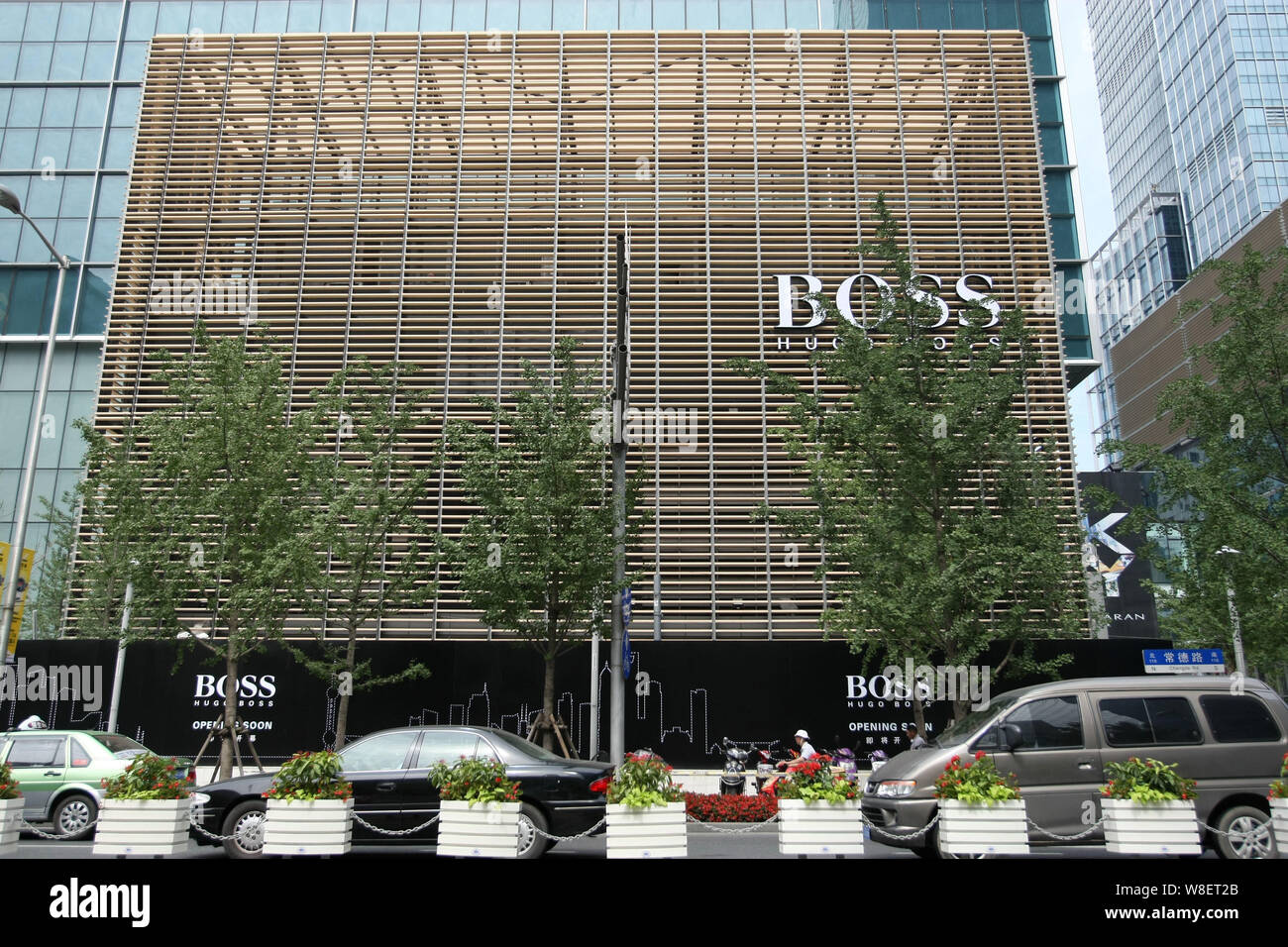 FILE--View of a new Hugo Boss shop under preparation at the corner of  Changde Road and West Nanjing Road in Shanghai, China, 2 July 2013. Nearly  3 Stock Photo - Alamy