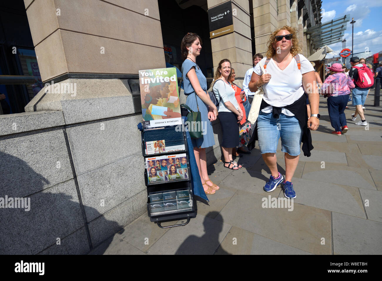 London, England, UK. Jehova's Witnesses outside Westminster Underground Station distributing copies of 'Awake!' Stock Photo