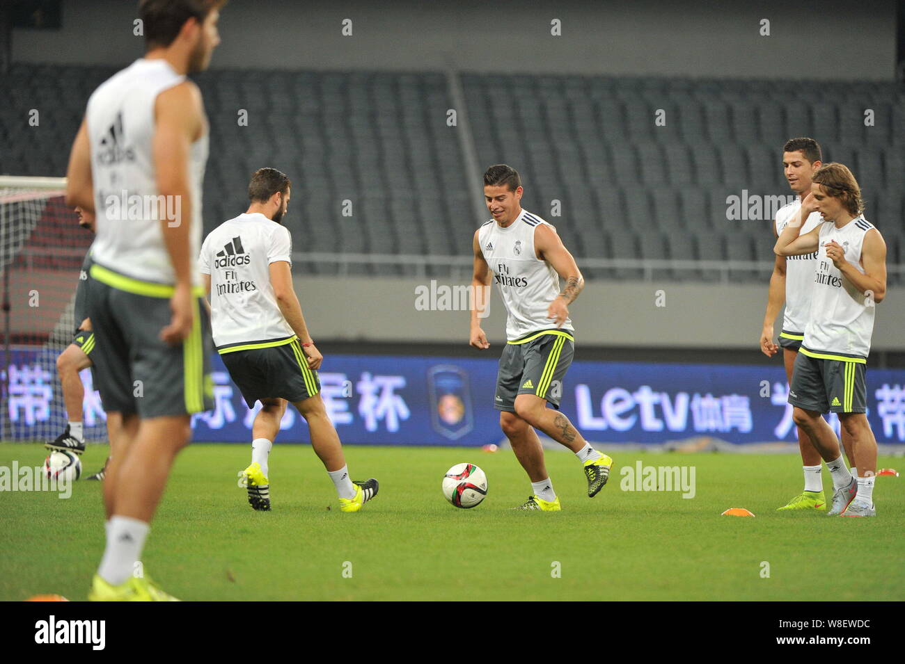 James Rodriguez, center, and teammates of Real Madrid take part in a training session in Shanghai, China, 29 July 2015. Stock Photo