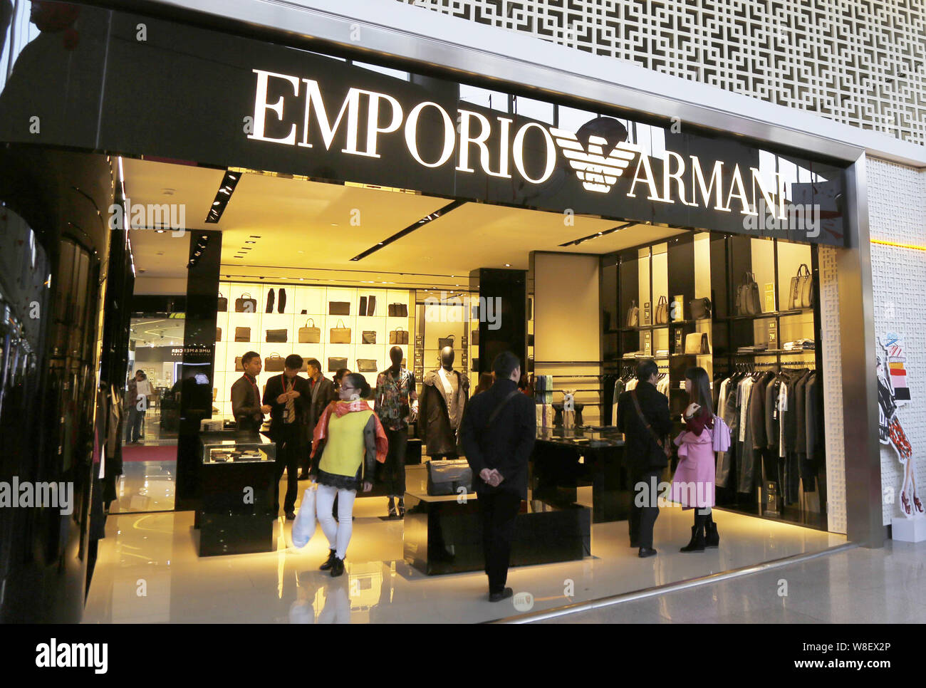 FILE--Customers shop at a Emporio Armani boutique at the Haikou Meilan  International Airport in Haikou city, south Chinas Hainan province, 21  Decemb Stock Photo - Alamy