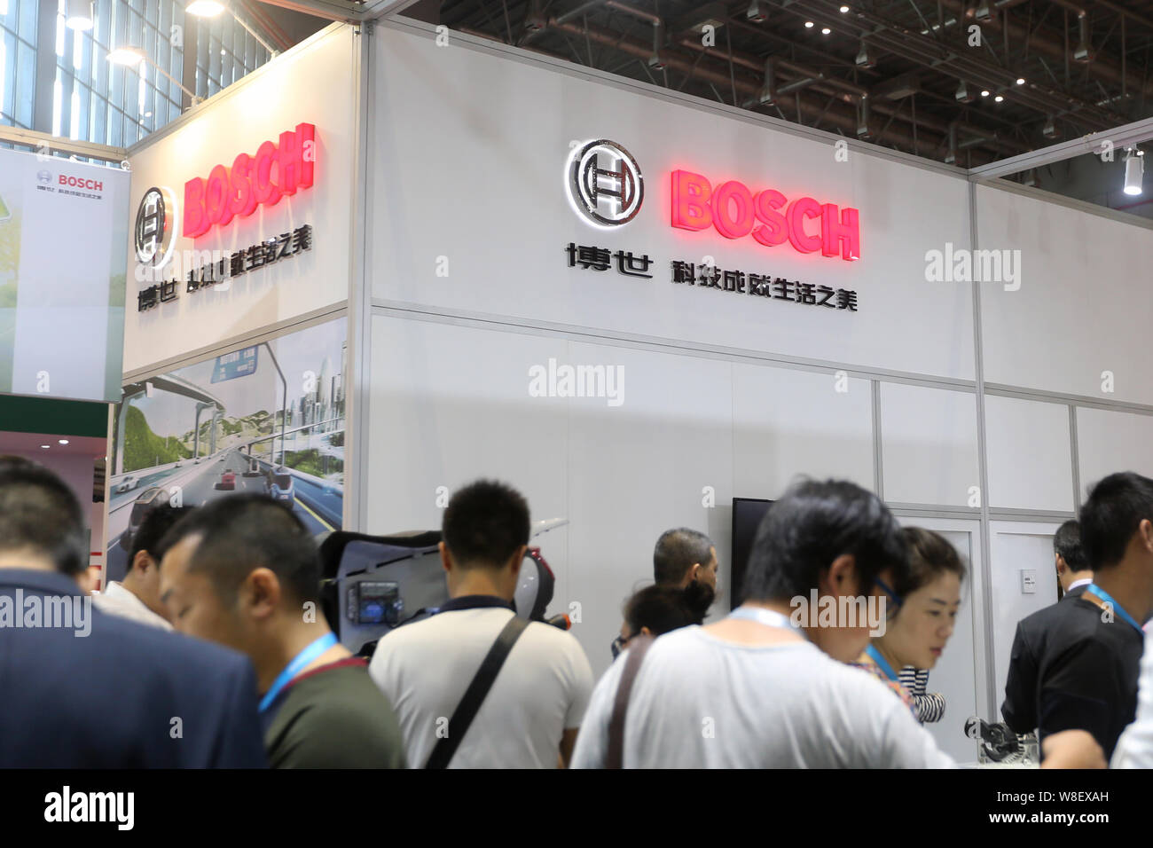 FILEPeople visit the stand of Bosch during an exhibition in