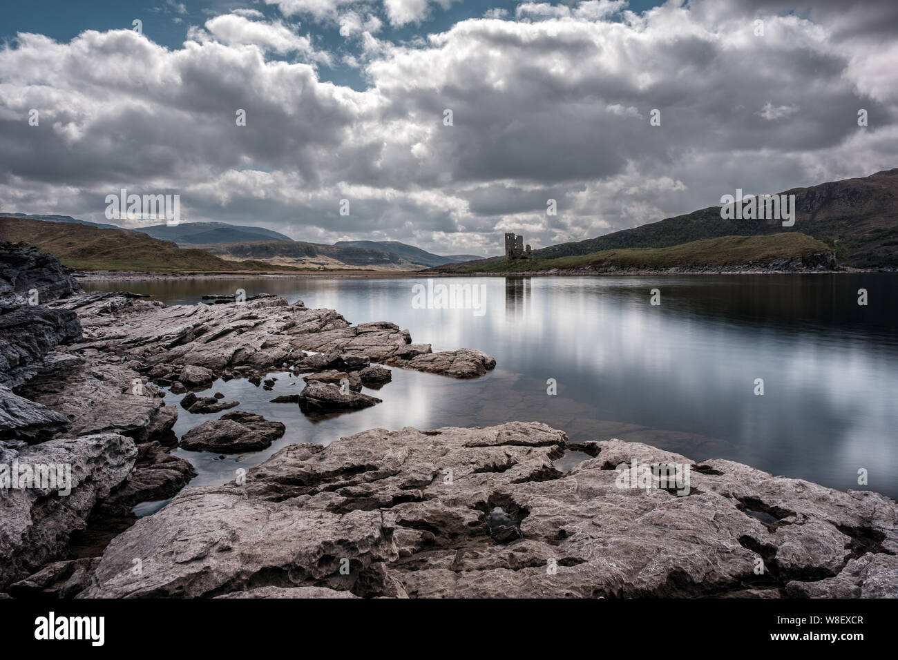 Ruins of 15th century Ardvreck Castle standing on a Promontory on the banks of Loch Assynt in the Highloands of Scotland Stock Photo
